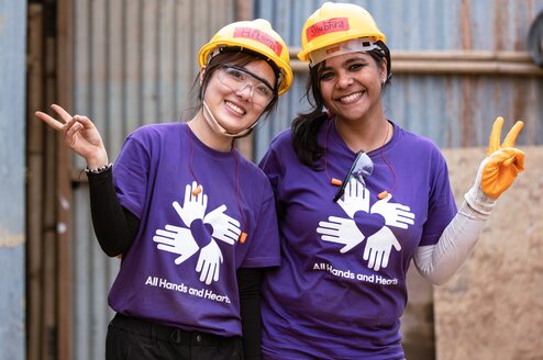 Volunteers wearing purple shirts in Nepal